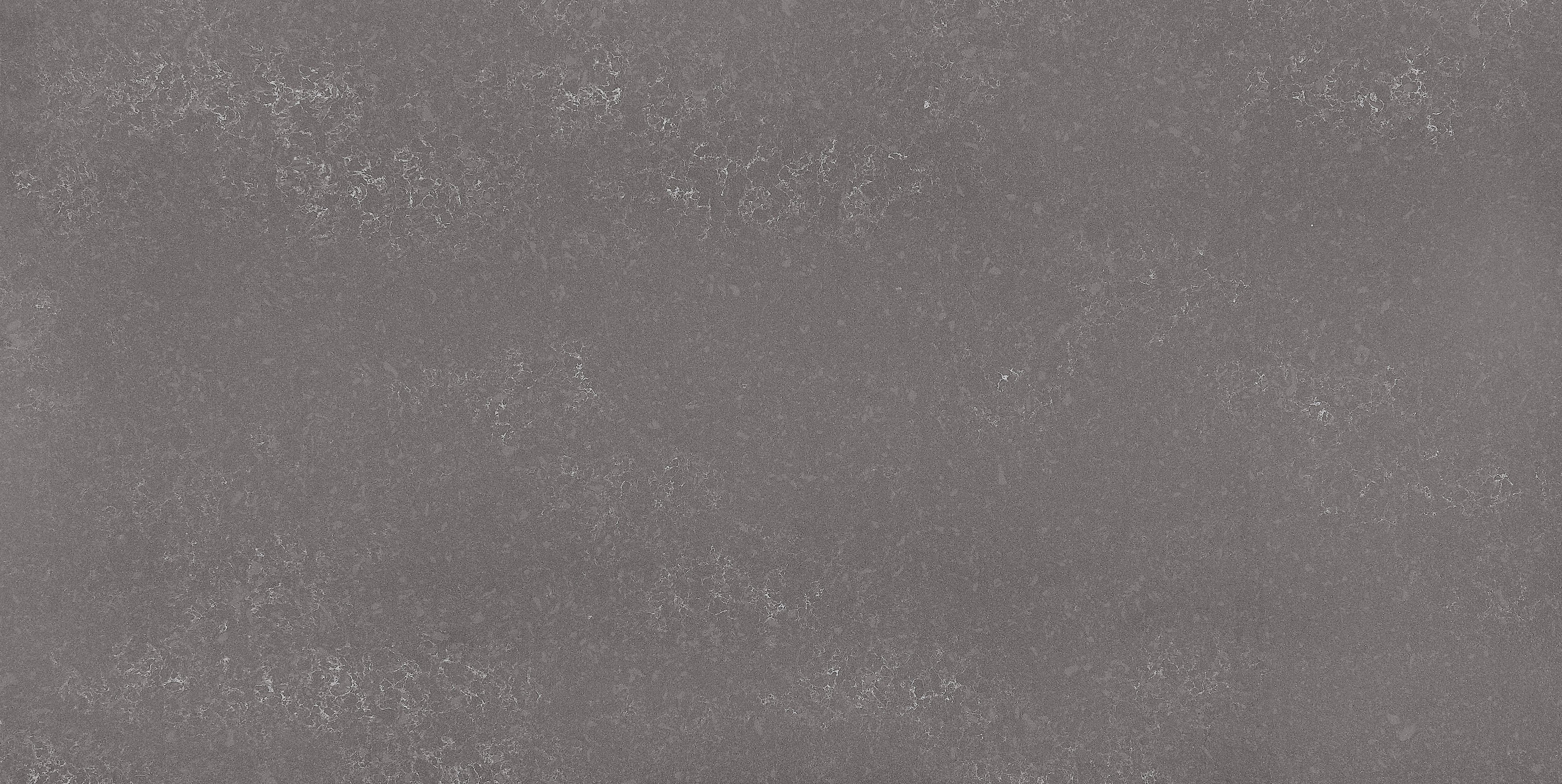HanStone Quartz Storm warm dark quartz countertop surface with river washed textured finish full slab